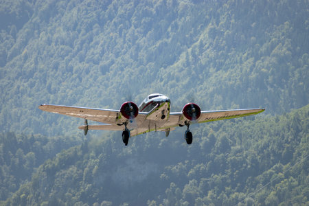 Mollis, Switzerland, August 18, 2023 NC-18125 Lockheed Model 12 Electra Junior historic aircraft is taking off from runway 01のeditorial素材