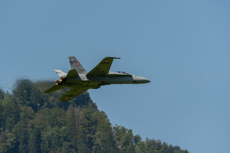 Mollis, Switzerland, August 18, 2023 Swiss military McDonnell Douglas F/A-18 hornet fighter is doing performances during an air displayのeditorial素材