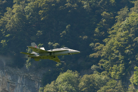 Mollis, Switzerland, August 18, 2023 Swiss military McDonnell Douglas F/A-18 hornet fighter is doing performances during an air displayのeditorial素材