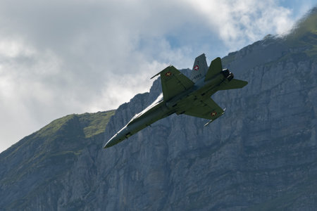 Mollis, Switzerland, August 18, 2023 Swiss military McDonnell Douglas F/A-18 hornet fighter is doing performances during an air displayのeditorial素材