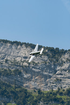 Mollis, Switzerland, August 18, 2023 NC-18125 Lockheed Model 12 Electra Junior aircraft is performing during an air showのeditorial素材
