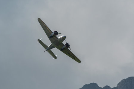Mollis, Switzerland, August 18, 2023 NC-18125 Lockheed Model 12 Electra Junior aircraft is performing during an air showのeditorial素材