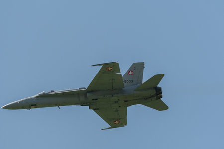 Mollis, Switzerland, August 18, 2023 Swiss military McDonnell Douglas F/A-18 hornet fighter is doing performances during an air displayのeditorial素材