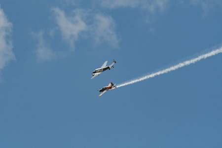 Mollis, Switzerland, August 18, 2023 Lockheed Model 12 Electra Junior and a Pilatus P-3-05 aircraft in formation flight during an air showのeditorial素材