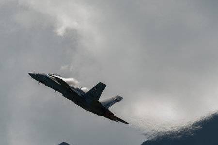 Mollis, Switzerland, August 18, 2023 Swiss military McDonnell Douglas F/A-18 hornet fighter is doing performances during an air displayのeditorial素材
