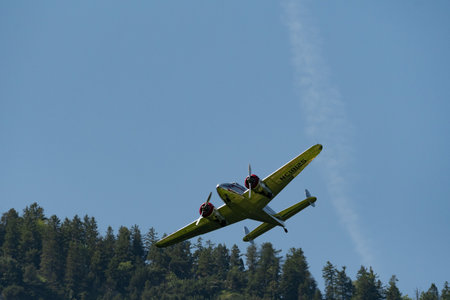 Mollis, Switzerland, August 18, 2023 NC-18125 Lockheed Model 12 Electra Junior aircraft is performing during an air showのeditorial素材