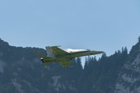 Mollis, Switzerland, August 18, 2023 Swiss military McDonnell Douglas F/A-18 hornet fighter is doing performances during an air displayのeditorial素材