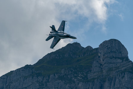 Mollis, Switzerland, August 18, 2023 Swiss military McDonnell Douglas F/A-18 hornet fighter is doing performances during an air displayのeditorial素材