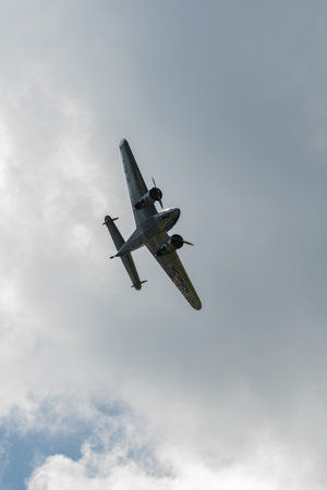 Mollis, Switzerland, August 18, 2023 NC-18125 Lockheed Model 12 Electra Junior aircraft is performing during an air showのeditorial素材
