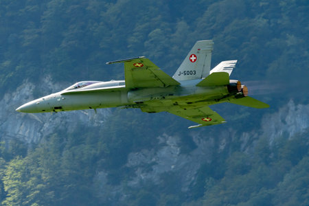 Mollis, Switzerland, August 18, 2023 Swiss military McDonnell Douglas F/A-18 hornet fighter is doing performances during an air displayのeditorial素材