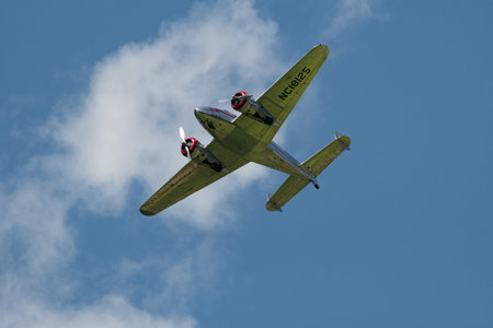 Mollis, Switzerland, August 18, 2023 NC-18125 Lockheed Model 12 Electra Junior aircraft is performing during an air showのeditorial素材