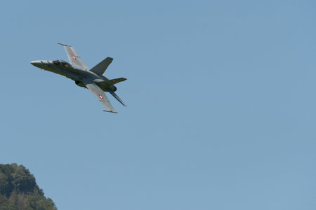 Mollis, Switzerland, August 18, 2023 Swiss military McDonnell Douglas F/A-18 hornet fighter is doing performances during an air displayのeditorial素材