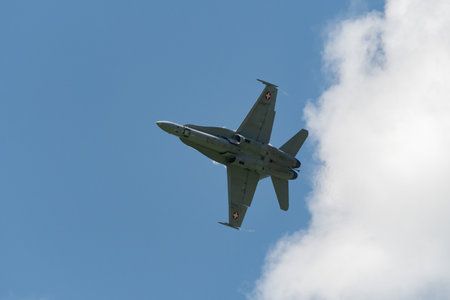 Mollis, Switzerland, August 18, 2023 Swiss military McDonnell Douglas F/A-18 hornet fighter is doing performances during an air displayのeditorial素材