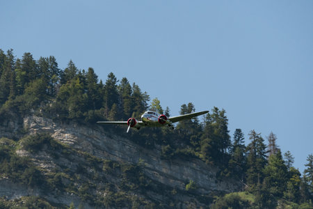 Mollis, Switzerland, August 18, 2023 NC-18125 Lockheed Model 12 Electra Junior aircraft is performing during an air showのeditorial素材