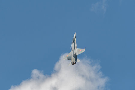 Mollis, Switzerland, August 18, 2023 Swiss military McDonnell Douglas F/A-18 hornet fighter is doing performances during an air displayのeditorial素材