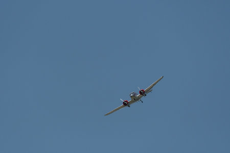 Mollis, Switzerland, August 18, 2023 NC-18125 Lockheed Model 12 Electra Junior aircraft is performing during an air showのeditorial素材