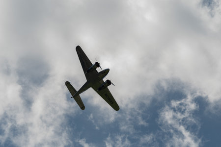 Mollis, Switzerland, August 18, 2023 NC-18125 Lockheed Model 12 Electra Junior aircraft is performing during an air showのeditorial素材