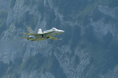 Mollis, Switzerland, August 18, 2023 Swiss military McDonnell Douglas F/A-18 hornet fighter is doing performances during an air displayのeditorial素材
