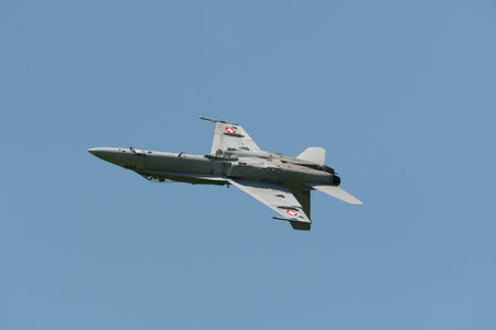Mollis, Switzerland, August 18, 2023 Swiss military McDonnell Douglas F/A-18 hornet fighter is doing performances during an air displayのeditorial素材