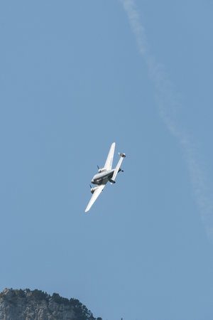 Mollis, Switzerland, August 18, 2023 NC-18125 Lockheed Model 12 Electra Junior aircraft is performing during an air showのeditorial素材