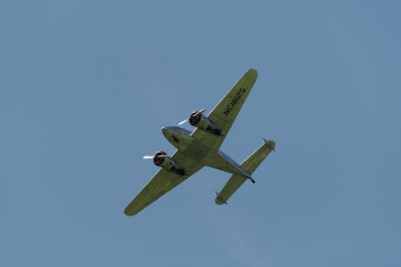 Mollis, Switzerland, August 18, 2023 NC-18125 Lockheed Model 12 Electra Junior aircraft is performing during an air showのeditorial素材