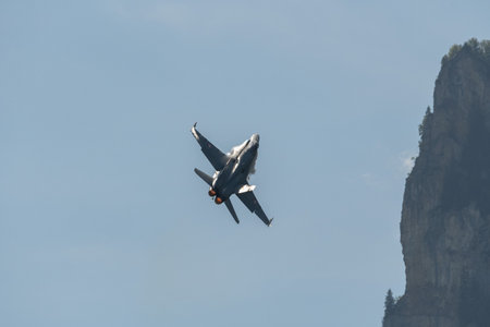 Mollis, Switzerland, August 18, 2023 Swiss military McDonnell Douglas F/A-18 hornet fighter is doing performances during an air displayのeditorial素材