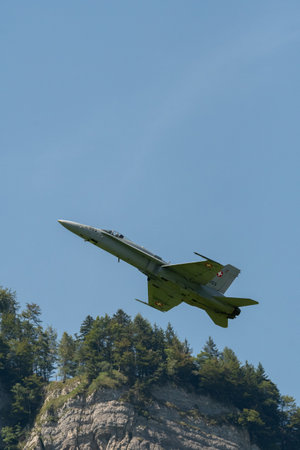 Mollis, Switzerland, August 18, 2023 Swiss military McDonnell Douglas F/A-18 hornet fighter is doing performances during an air displayのeditorial素材