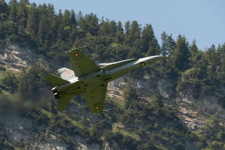 Mollis, Switzerland, August 18, 2023 Swiss military McDonnell Douglas F/A-18 hornet fighter is doing performances during an air displayのeditorial素材