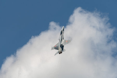 Mollis, Switzerland, August 18, 2023 Swiss military McDonnell Douglas F/A-18 hornet fighter is doing performances during an air displayのeditorial素材