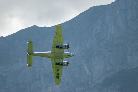 Mollis, Switzerland, August 18, 2023 NC-18125 Lockheed Model 12 Electra Junior aircraft is performing during an air showのeditorial素材