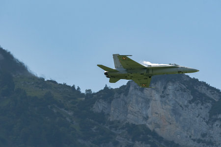 Mollis, Switzerland, August 18, 2023 Swiss military McDonnell Douglas F/A-18 hornet fighter is doing performances during an air displayのeditorial素材