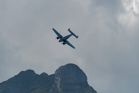 Mollis, Switzerland, August 18, 2023 NC-18125 Lockheed Model 12 Electra Junior aircraft is performing during an air showのeditorial素材