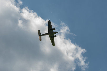 Mollis, Switzerland, August 18, 2023 NC-18125 Lockheed Model 12 Electra Junior aircraft is performing during an air showのeditorial素材