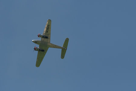 Mollis, Switzerland, August 18, 2023 NC-18125 Lockheed Model 12 Electra Junior aircraft is performing during an air showのeditorial素材