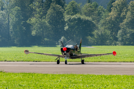 Mollis, Switzerland, August 18, 2023 SIAI Marchetti SF260 acrobatic aircraft is taxiing on the runwayのeditorial素材
