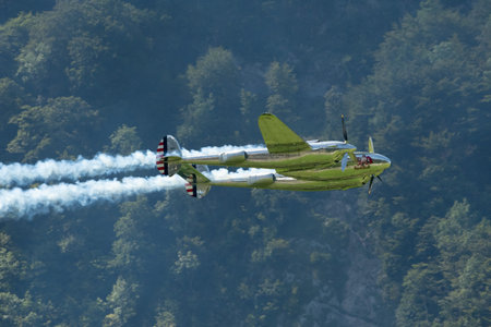 Mollis, Switzerland, August 18, 2023 N-25Y Lockheed P-38L Lightning historic aircraft during an air showのeditorial素材