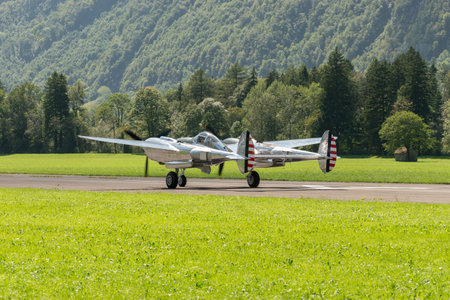 Mollis, Switzerland, August 18, 2023 N-25Y Lockheed P-38L Lightning historic aircraft is taxiing on the runwayのeditorial素材