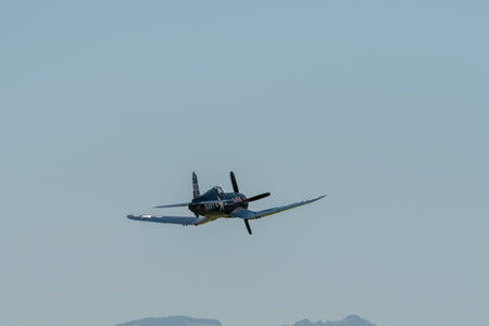 Mollis, Switzerland, August 18, 2023 OE-EAS Chance Vought F4U-4 Corsair historic aircraft is taking off from runway 01 during an air showのeditorial素材