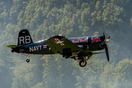 Mollis, Switzerland, August 18, 2023 OE-EAS Chance Vought F4U-4 Corsair historic aircraft is taking off from runway 01 during an air showのeditorial素材