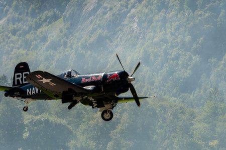 Mollis, Switzerland, August 18, 2023 OE-EAS Chance Vought F4U-4 Corsair historic aircraft is taking off from runway 01 during an air showのeditorial素材