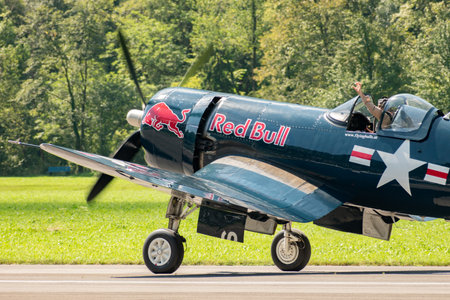 Mollis, Switzerland, August 18, 2023 OE-EAS Chance Vought F4U-4 Corsair aircraft is taxiing on the runwayのeditorial素材