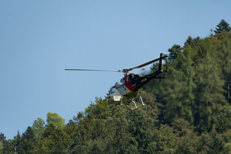 Mollis, Switzerland, August 18, 2023 HB-ZUA AS-350B H125 helicopter during an air displayのeditorial素材