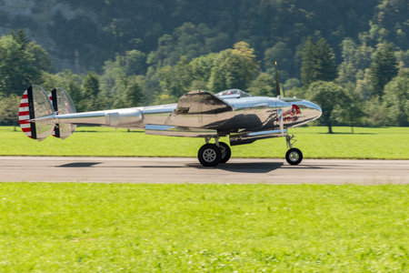 Mollis, Switzerland, August 18, 2023 N-25Y Lockheed P-38L Lightning historic aircraft is taxiing on the runwayのeditorial素材