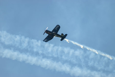 Mollis, Switzerland, August 18, 2023 OE-EAS Chance Vought F4U-4 Corsair historic aircraft performing during an air displayのeditorial素材