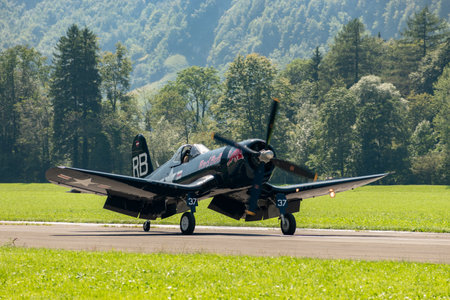 Mollis, Switzerland, August 18, 2023 OE-EAS Chance Vought F4U-4 Corsair historic aircraft is taxiing on the runwayのeditorial素材
