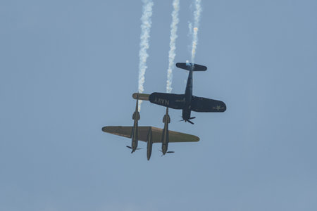 Mollis, Switzerland, August 18, 2023 Lockheed P-38L Lightning and a Chance Vought F4U-4 Corsair...