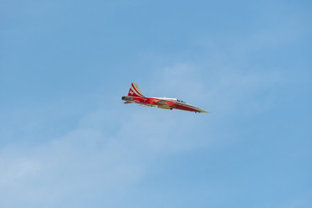 Mollis, Switzerland, August 18, 2023 Patrouille Suisse Northrop F-5E Tiger II military jet doing acrobatic flights during an air displayのeditorial素材