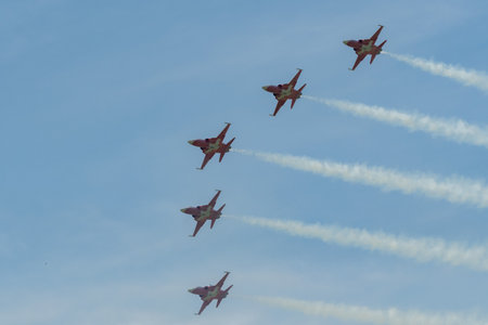 Mollis, Switzerland, August 18, 2023 Patrouille Suisse Northrop F-5E Tiger II military jet doing acrobatic flights during an air displayのeditorial素材