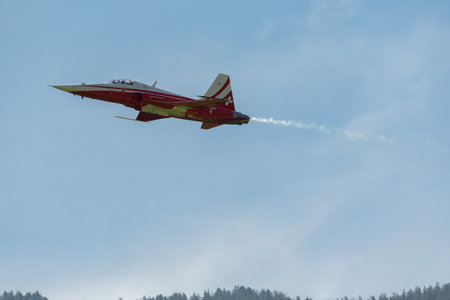 Mollis, Switzerland, August 18, 2023 Patrouille Suisse Northrop F-5E Tiger II military jet doing acrobatic flights during an air displayのeditorial素材