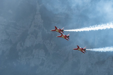 Mollis, Switzerland, August 18, 2023 Patrouille Suisse Northrop F-5E Tiger II military jet doing acrobatic flights during an air displayのeditorial素材